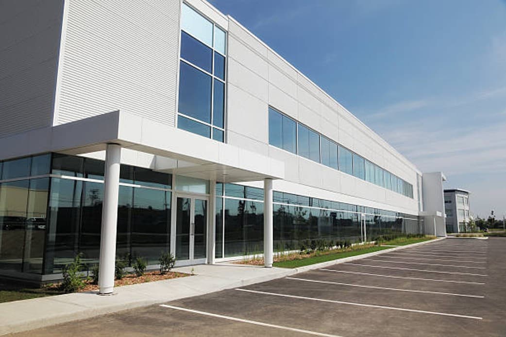 Modern office interior with glass partitions and professional workspace